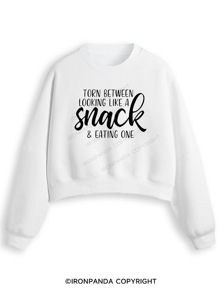 TORN BETWEEN A SNACK AND EAT ONE Fleece Crop Sweatshirt