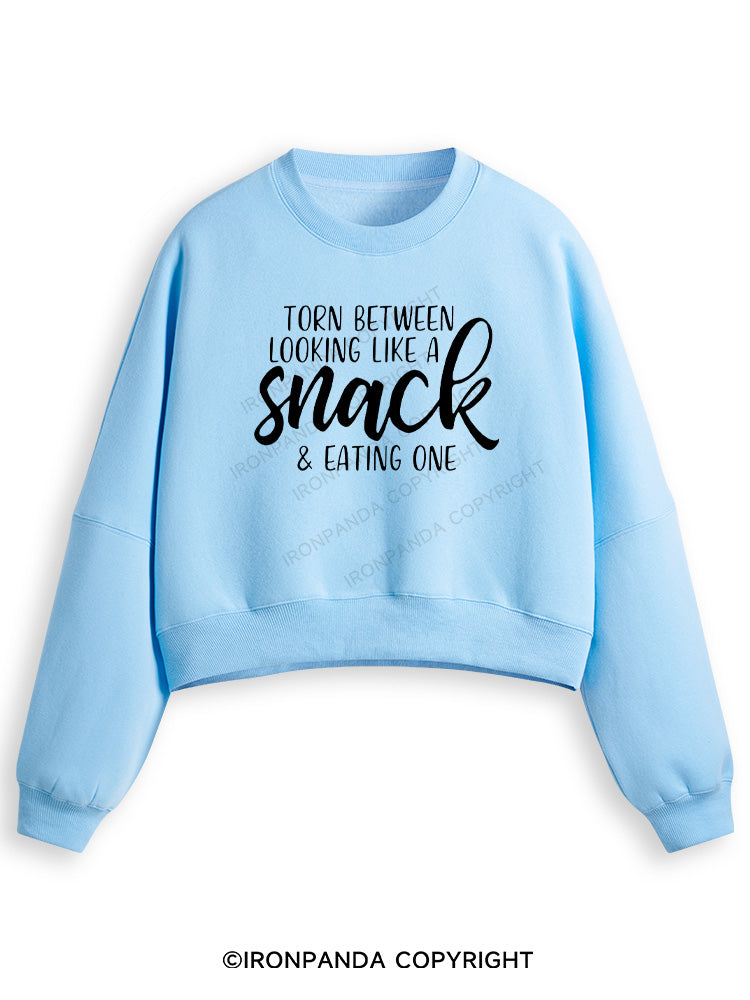 TORN BETWEEN A SNACK AND EAT ONE Fleece Crop Sweatshirt