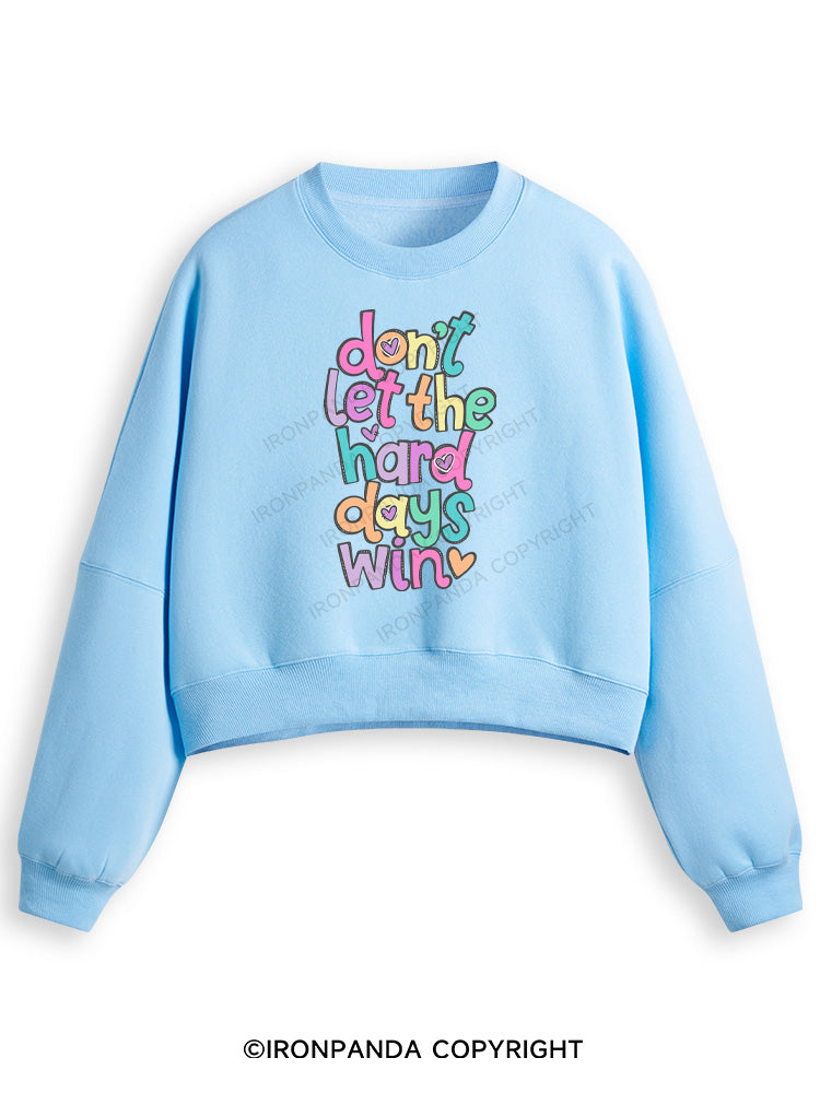DON'T LET THE HARD DAYS WIN Fleece Crop Sweatshirt