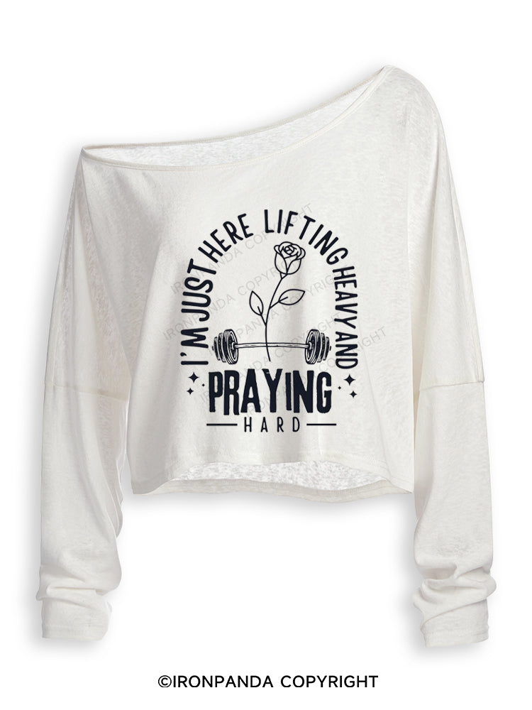 I'M JUST HERE LIFTING HEAVY AND PRAYING HARD Off Shoulder Long Sleeve Crop Top