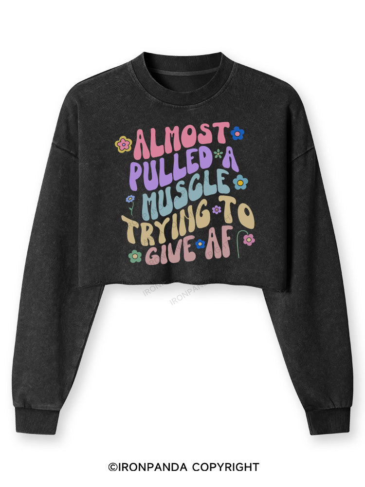 ALMOST PULLED A MUSCLE TRYING TO GIVE AF Washed Long-Sleeve Crop Top