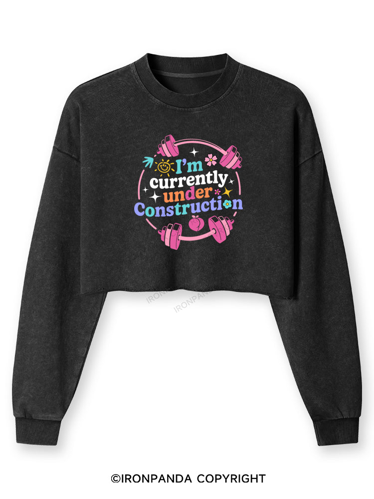 I'M CURRENTLY UNDER CONSTRUCTION Washed Long-Sleeve Crop Top