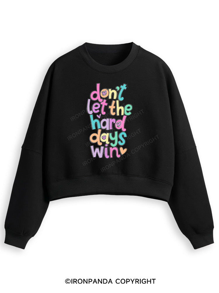 DON'T LET THE HARD DAYS WIN Fleece Crop Sweatshirt