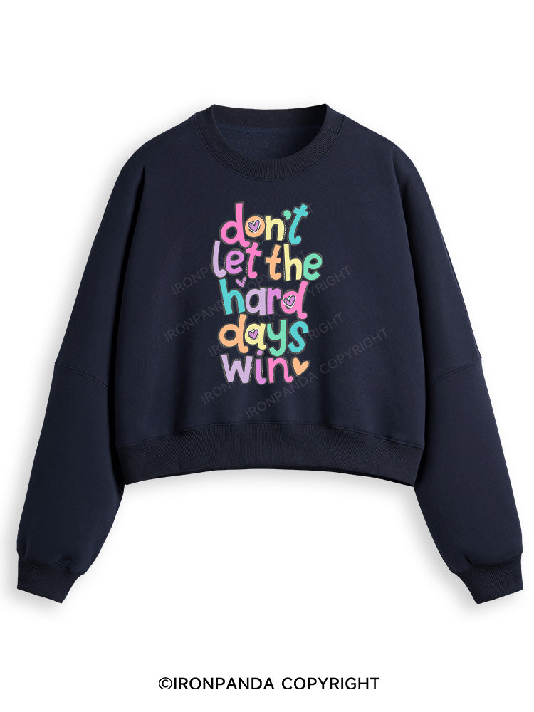 DON'T LET THE HARD DAYS WIN Fleece Crop Sweatshirt
