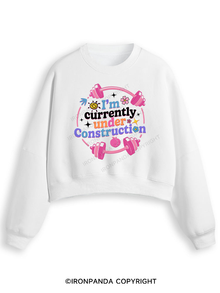 I'M CURRENTLY UNDER CONSTRUCTION Fleece Crop Sweatshirt