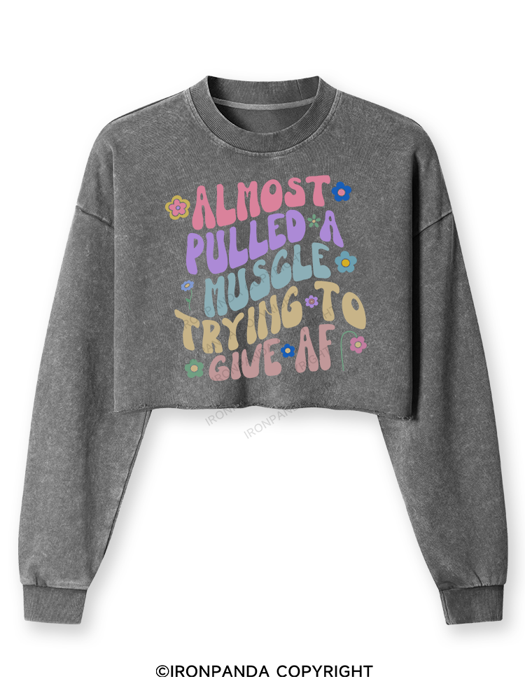 ALMOST PULLED A MUSCLE TRYING TO GIVE AF Washed Long-Sleeve Crop Top