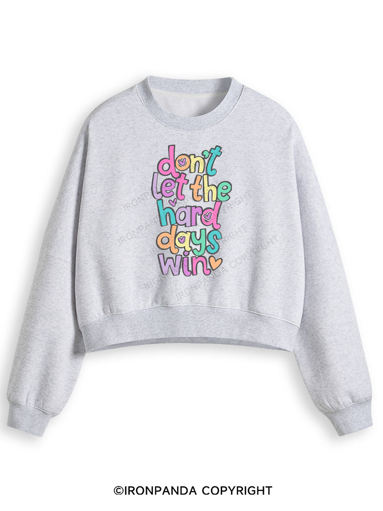 DON'T LET THE HARD DAYS WIN Fleece Crop Sweatshirt