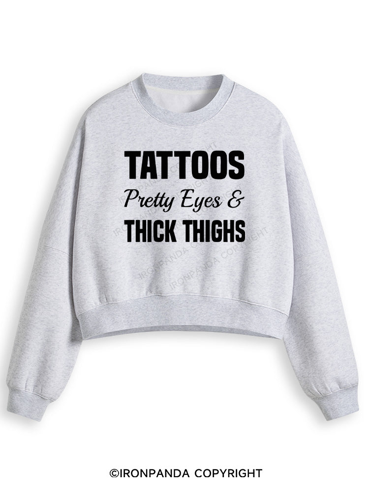 TATTOOS PRETTY EYES AND THICK THIGHS Fleece Crop Sweatshirt