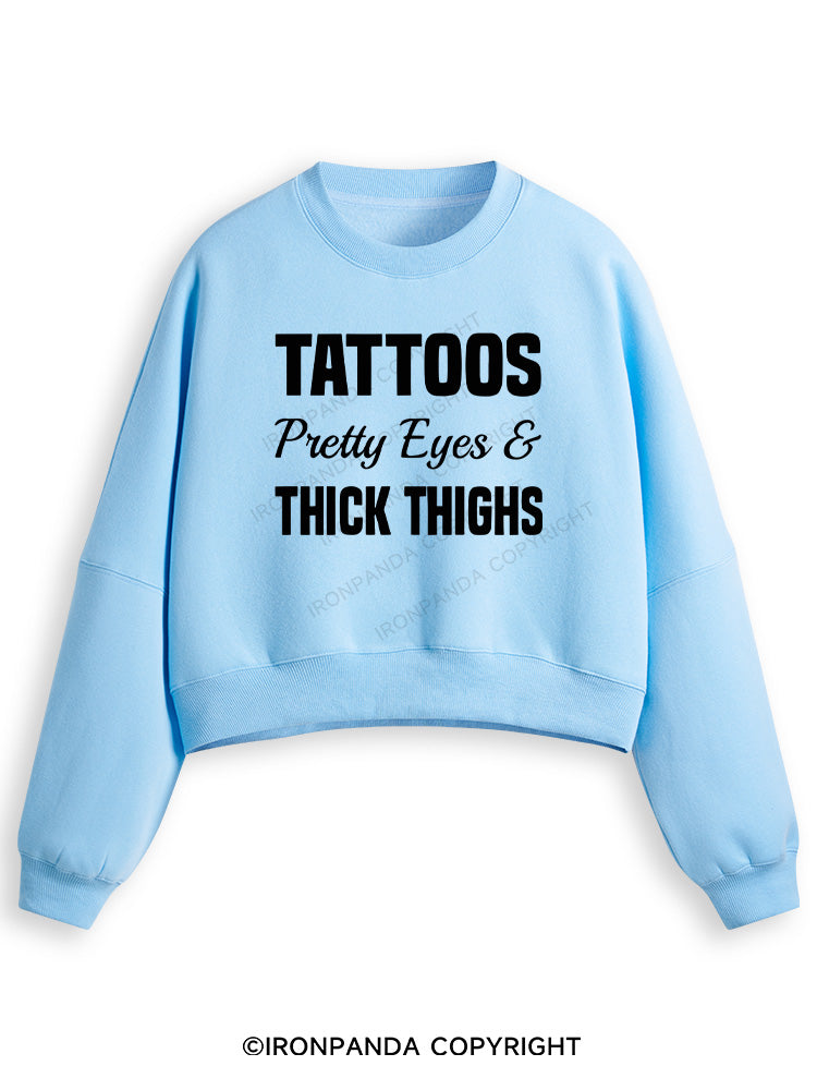 TATTOOS PRETTY EYES AND THICK THIGHS Fleece Crop Sweatshirt