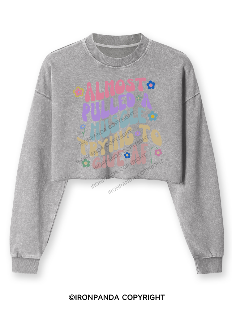 ALMOST PULLED A MUSCLE TRYING TO GIVE AF Washed Long-Sleeve Crop Top
