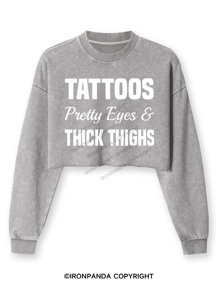 TATTOOS PRETTY EYES AND THICK THIGHS Washed Long-Sleeve Crop Top