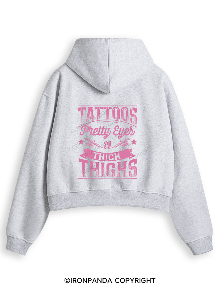 TATTOOS PRETTY EYES AND THICK THIGHS Fleece Crop Zip Up Hoodie