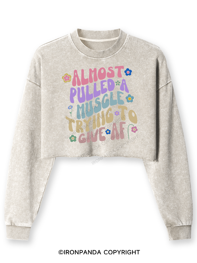 ALMOST PULLED A MUSCLE TRYING TO GIVE AF Washed Long-Sleeve Crop Top