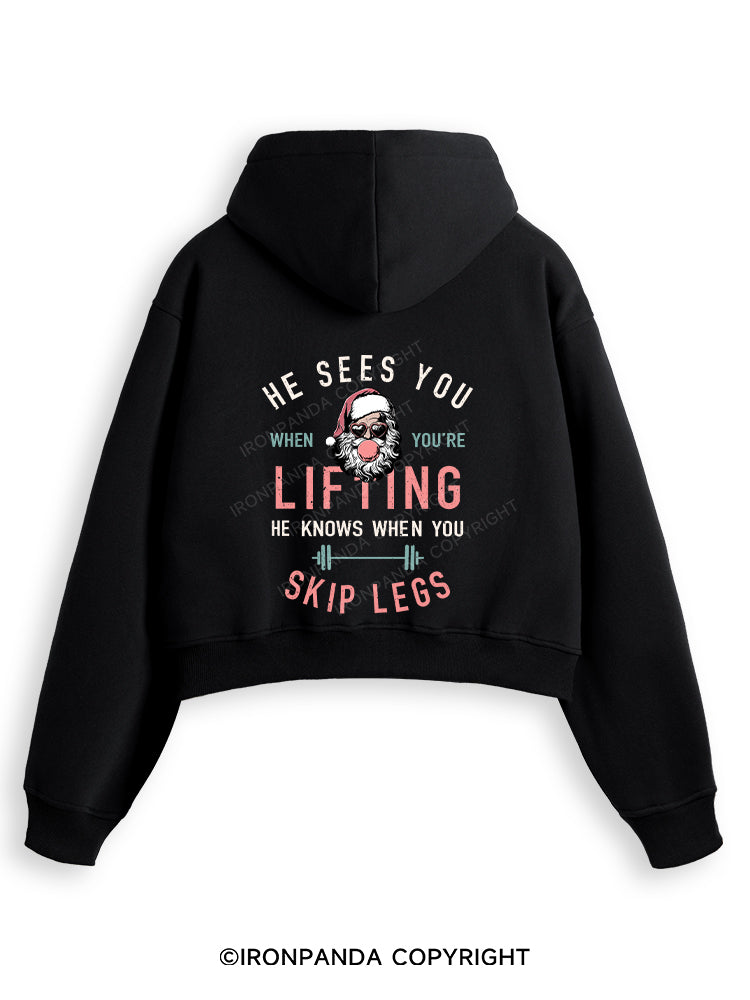 HE SEES YOU WHEN YOU'RE LIFTING Fleece Crop Zip Up Hoodie