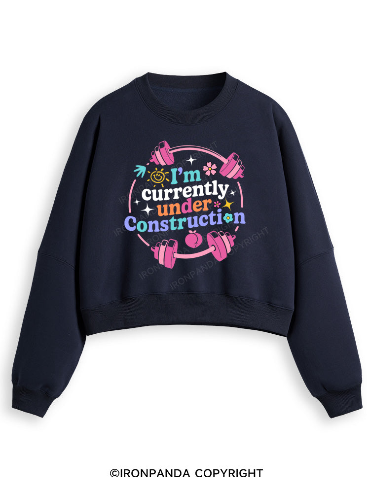 I'M CURRENTLY UNDER CONSTRUCTION Fleece Crop Sweatshirt