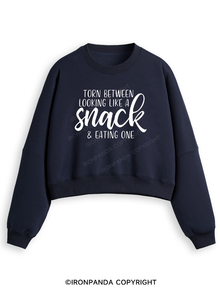 TORN BETWEEN A SNACK AND EAT ONE Fleece Crop Sweatshirt