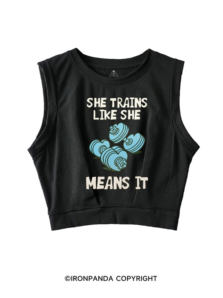 SHE TRAINS LIKE SHE MEANS IT FUNNY GYM SLEEVELESS CROP TOPS