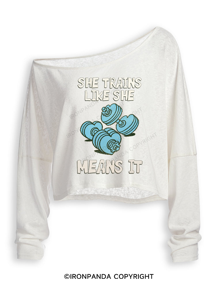 SHE TRAINS LIKE SHE MEANS IT FUNNY GYM Off Shoulder Long Sleeve Crop Top