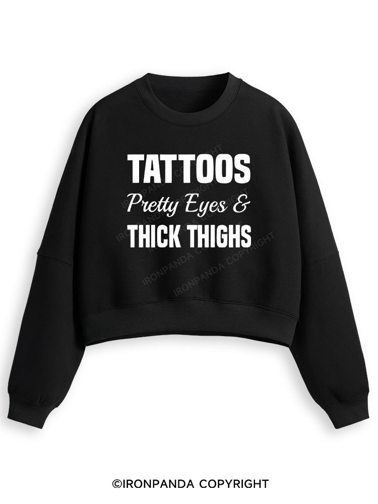 TATTOOS PRETTY EYES AND THICK THIGHS Fleece Crop Sweatshirt