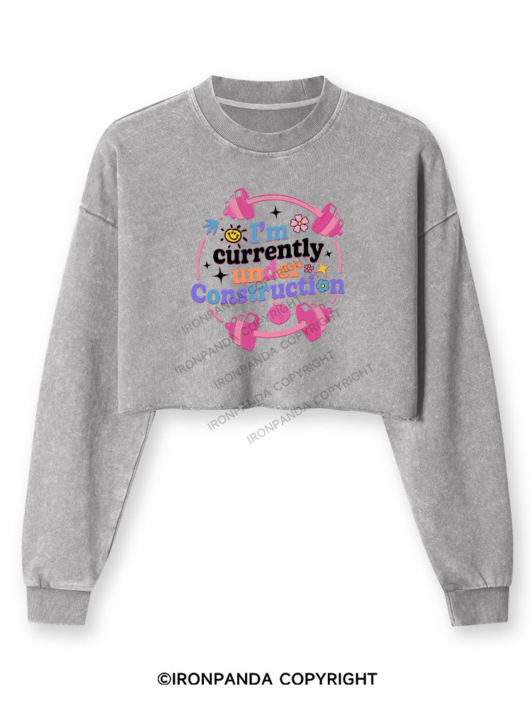 I'M CURRENTLY UNDER CONSTRUCTION Washed Long-Sleeve Crop Top