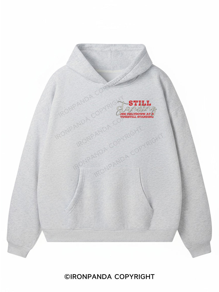 STILL STANDING ONE MELTDOWN AT A TIME Premium Fleece Gym Hoodie