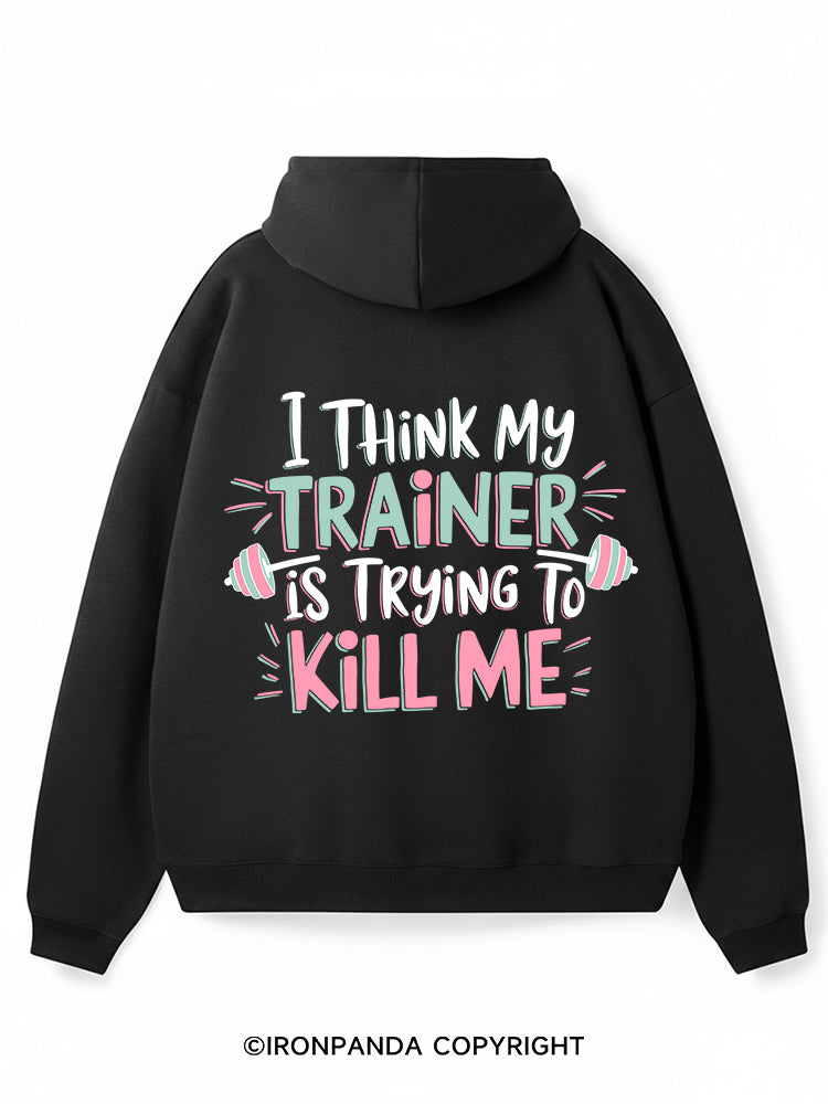 I THINK MY TRAINER IS TRYING TO KILL ME Premium Fleece Gym Hoodie