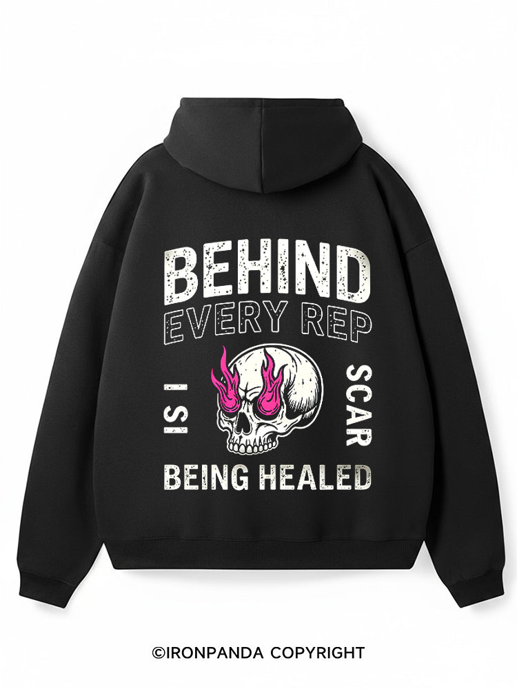 Behind every rep is a scar being healed Premium Fleece Gym Hoodie