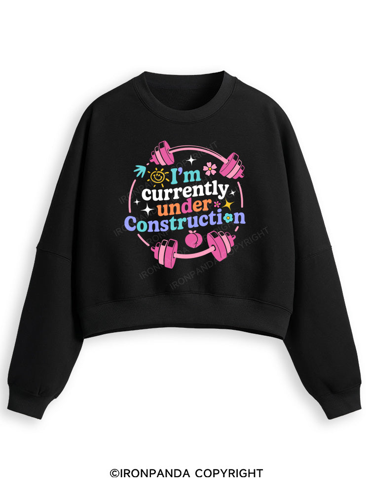 I'M CURRENTLY UNDER CONSTRUCTION Fleece Crop Sweatshirt