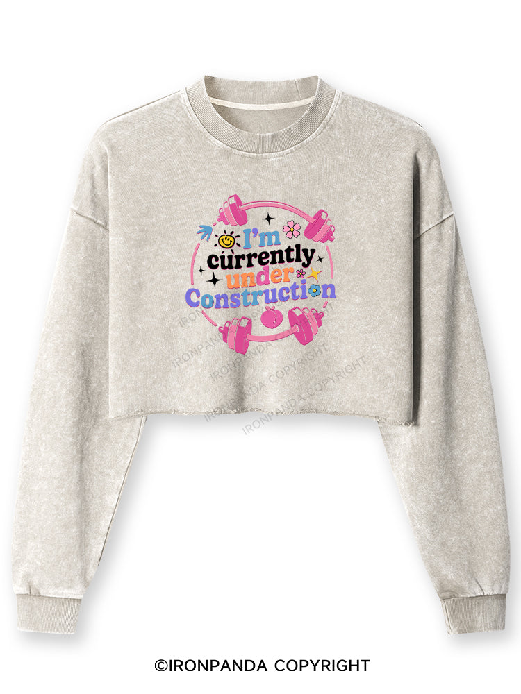 I'M CURRENTLY UNDER CONSTRUCTION Washed Long-Sleeve Crop Top