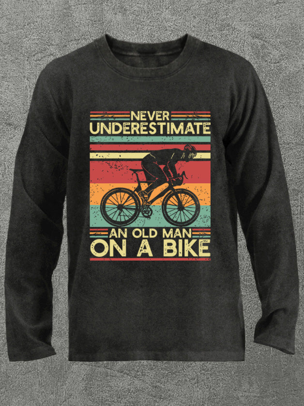 Never Underestimate an Old Man On a Bike Washed Gym Long Sleeve Shirt