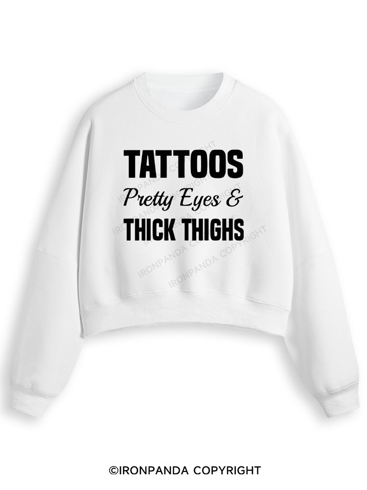 TATTOOS PRETTY EYES AND THICK THIGHS Fleece Crop Sweatshirt