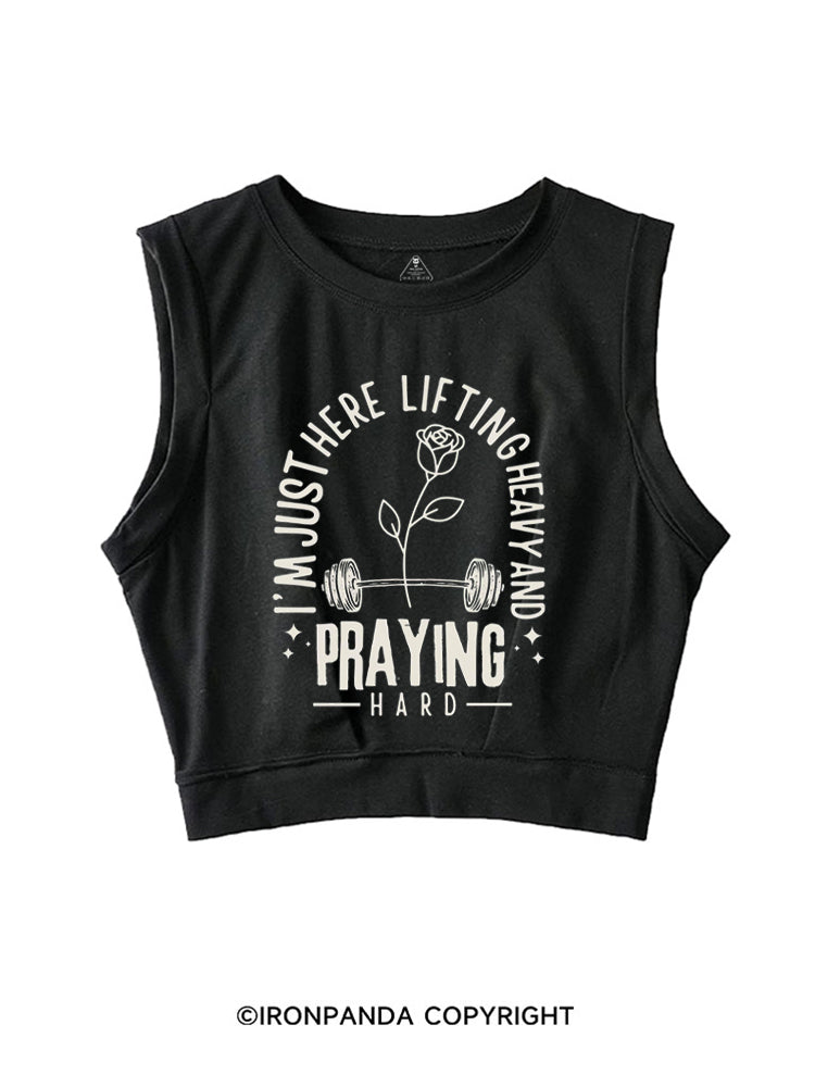 I'M JUST HERE LIFTING HEAVY AND PRAYING HARD SLEEVELESS CROP TOPS