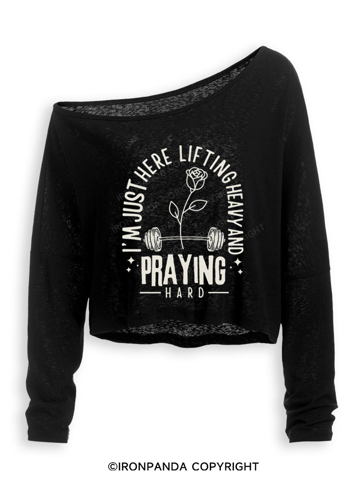 I'M JUST HERE LIFTING HEAVY AND PRAYING HARD Off Shoulder Long Sleeve Crop Top