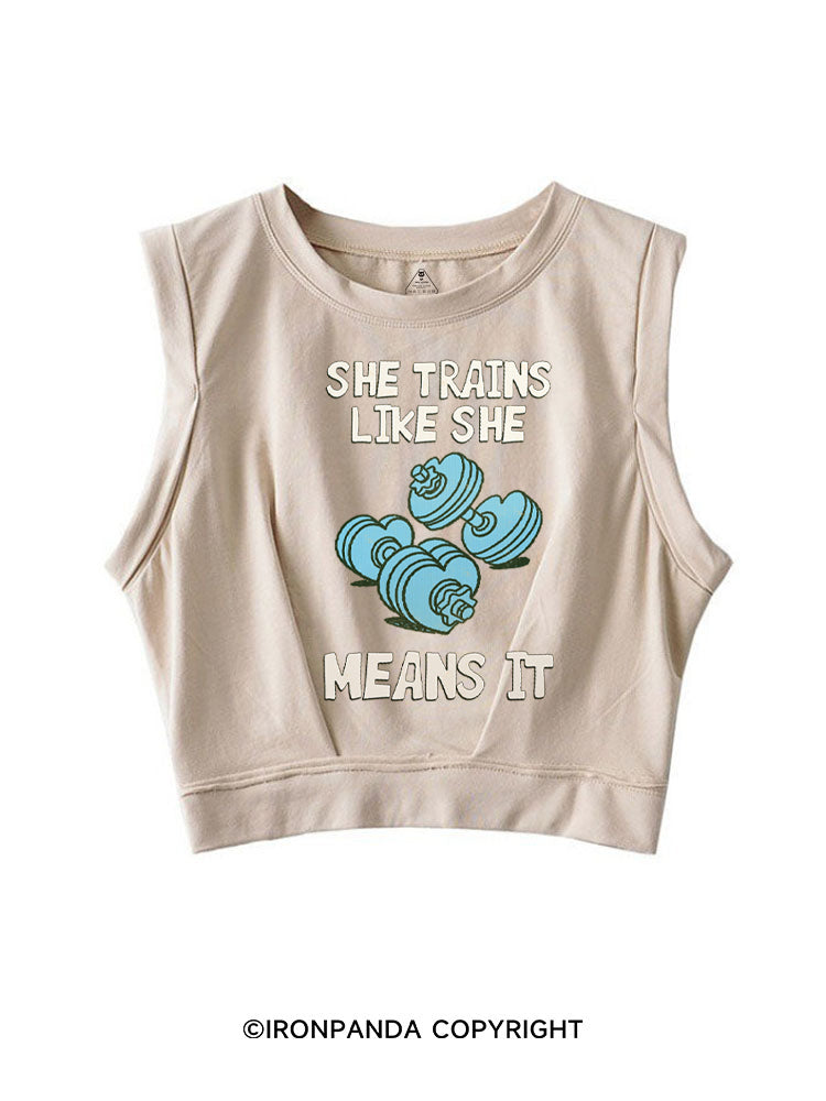 SHE TRAINS LIKE SHE MEANS IT FUNNY GYM SLEEVELESS CROP TOPS