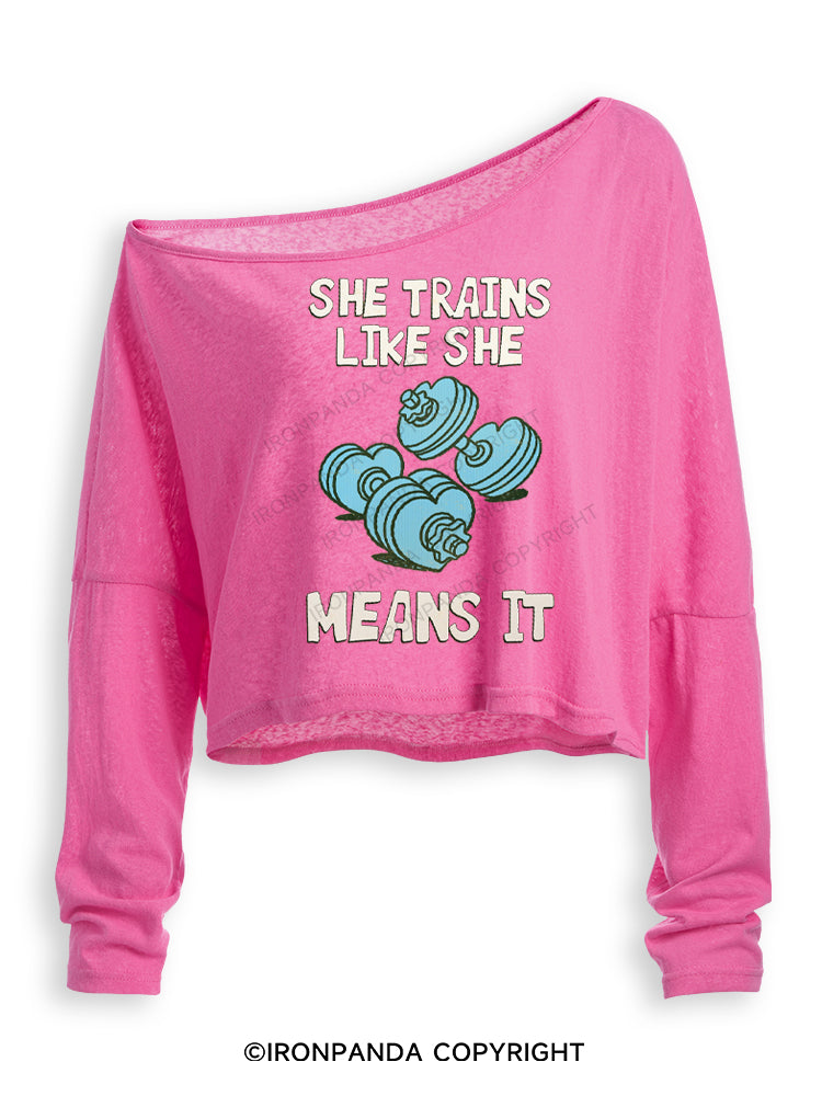 SHE TRAINS LIKE SHE MEANS IT FUNNY GYM Off Shoulder Long Sleeve Crop Top