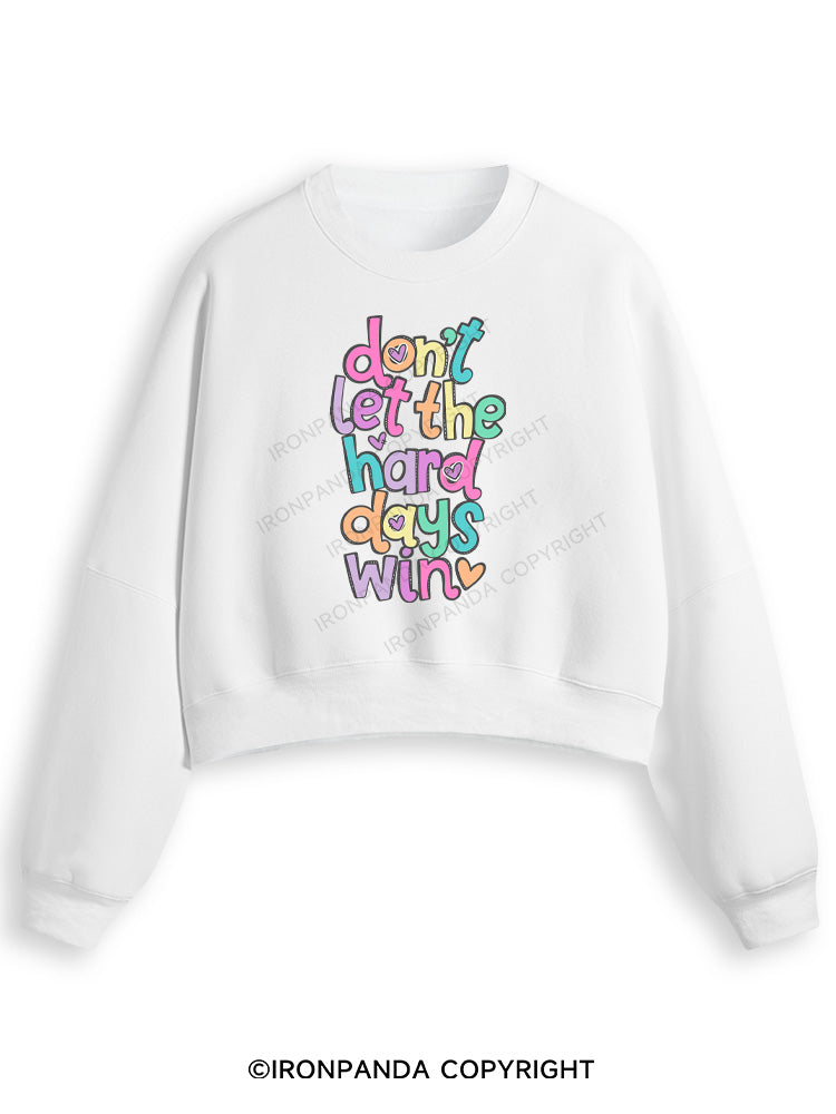 DON'T LET THE HARD DAYS WIN Fleece Crop Sweatshirt