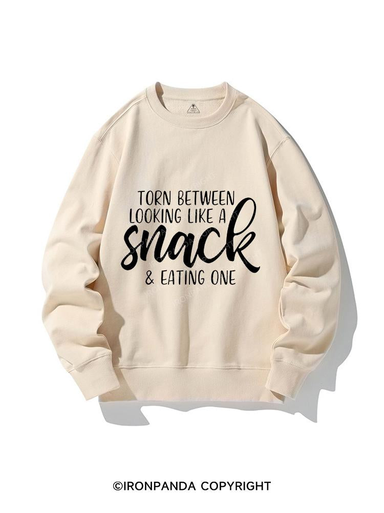 TORN BETWEEN A SNACK AND EAT ONE CREWNECK Sweatshirt