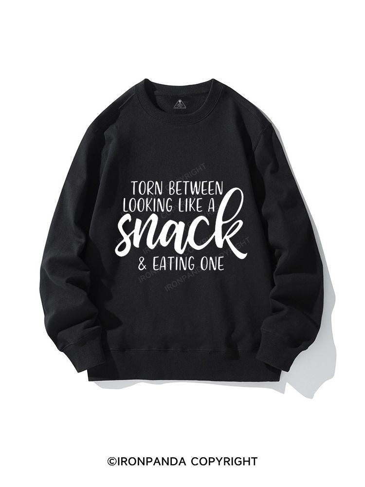 TORN BETWEEN A SNACK AND EAT ONE CREWNECK Sweatshirt
