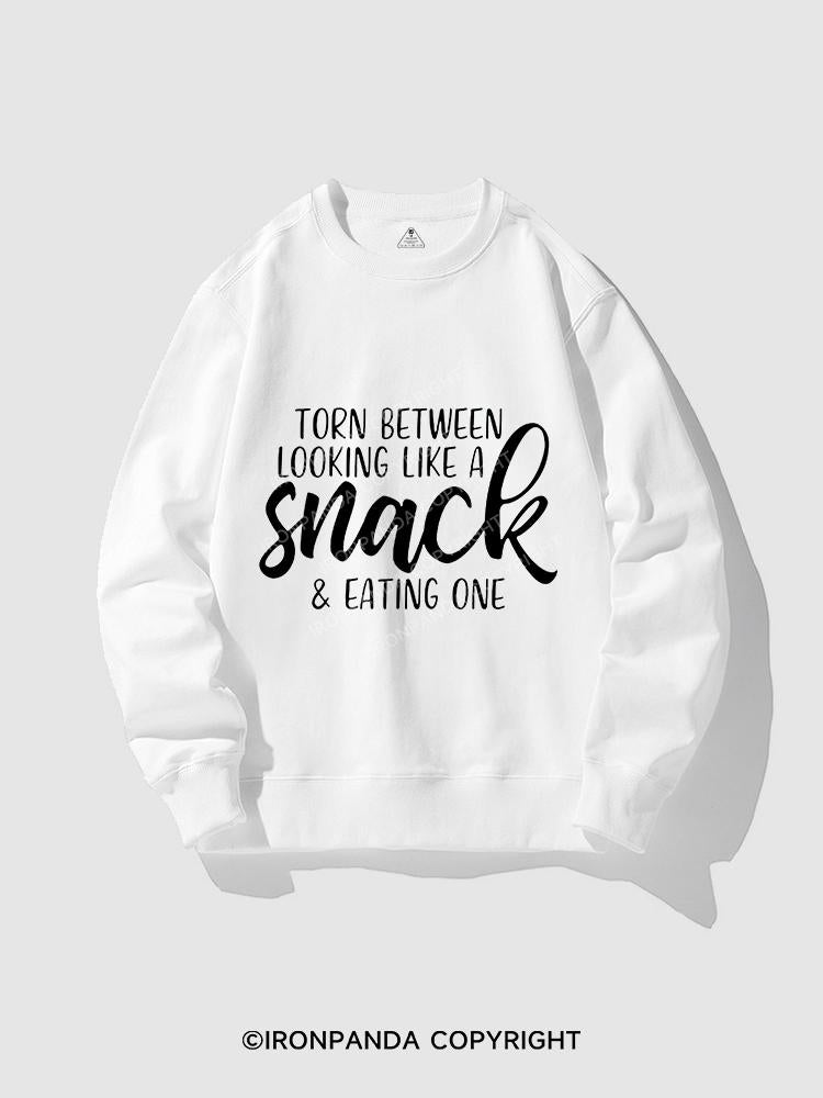 TORN BETWEEN A SNACK AND EAT ONE CREWNECK Sweatshirt