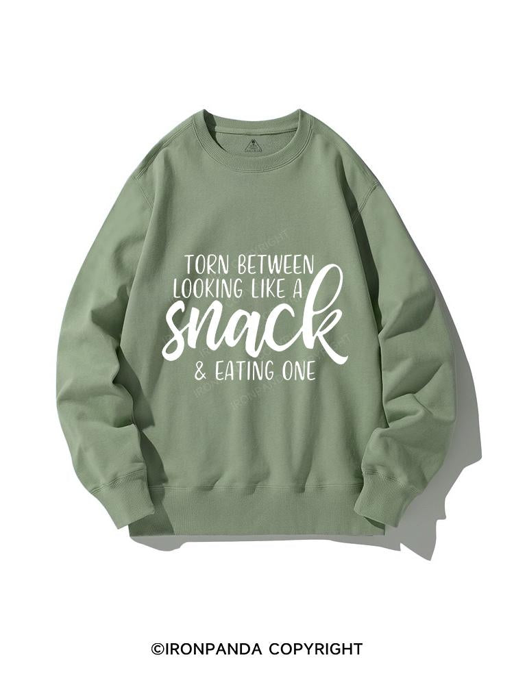 TORN BETWEEN A SNACK AND EAT ONE CREWNECK Sweatshirt